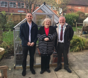 Left to right: Lewis Ronaldson from EnviroVent, with Patricia Harrison, resident of St Mary’s Court and Paul Sanderson from Sanctuary Housing, outside the new greenhouse.