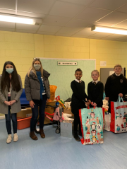 School children receive gifts from Star Refrigeration staff following a company-wide christmas appeal