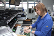 Evelin Fazekas is assembling a PCB for an EC motor.