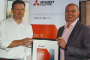 Mark Garstang (right) receives Coolair’s new partnership certification from Deane Flint, Mitsubishi Electric