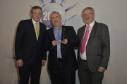 Left to right: Comedian and host Miles Jupp with Dave Pearson and Bitzer UK managing director, Kevin Glass, at the ACR News Awards. 