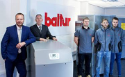 Left to right: EOGB’s technical director, Martin Cooke, and managing director, Paul Barritt , with members of the EOGB team in the new Baltur UK showroom.