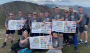 The J S Wright team celebrate at the end of their successful Snowdonia charity challenge: from left to right, back row, Simon Newland, Phil Leech, John Stevenson, Matt Coy, Ryan Quinlan, Gerry Rea, John Heggs, Julie Wilcox, Alan Whyte and Jamie Dove; and front row, Lucy Heggs and Chris Lyons